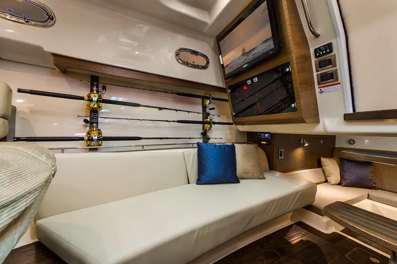  Yacht Photos Pics Manufacturer Provided Image: Interior of 2021 Boston Whaler 345 Conquest with fishing rods and comfortable seating.