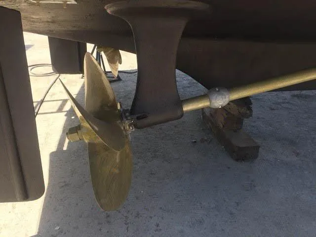 The West Star Yacht Photos Pics Propeller and shaft of a 1994 Shaw 57 boat on dry dock.