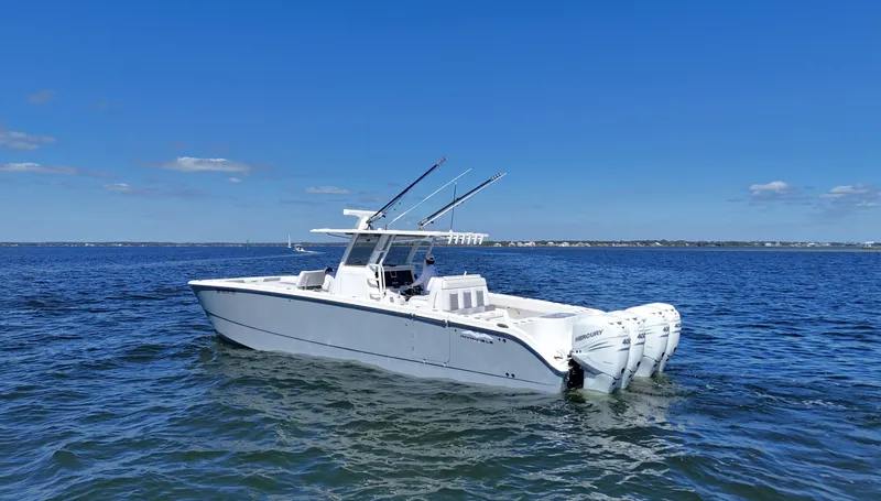 Engine Warranty X Trailer Yacht Photos Pics 2020 Invincible 37 Catamaran on open water, featuring triple Mercury outboard engines.