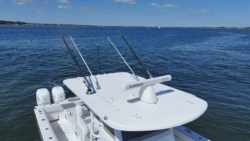 Engine Warranty X Trailer Yacht Photos Pics Invincible 37 Catamaran 2020 on water, equipped with Garmin technology and fishing rods.