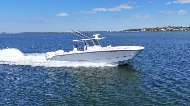 Engine Warranty X Trailer Yacht Photos Pics 2020 Invincible 37 Catamaran cruising on open water under clear skies.