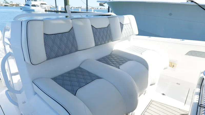 Engine Warranty X Trailer Yacht Photos Pics Luxurious seating on 2020 Invincible 37 Catamaran, featuring elegant diamond-pattern upholstery.