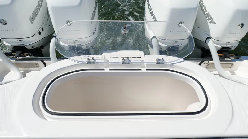 Engine Warranty X Trailer Yacht Photos Pics 2020 Invincible 37 Catamaran with Mercury outboard engines and open storage compartment.