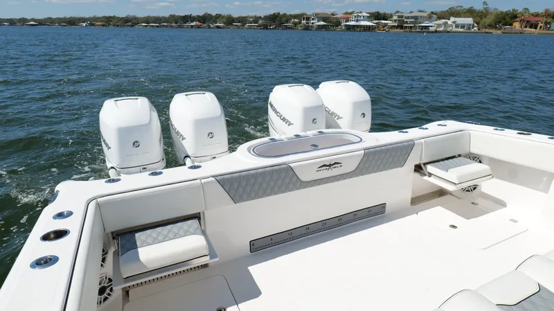 Engine Warranty X Trailer Yacht Photos Pics 2020 Invincible 37 Catamaran with four outboard engines on a calm water backdrop.