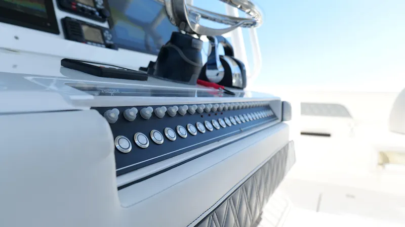 Engine Warranty X Trailer Yacht Photos Pics Control panel of a 2020 Invincible 37 Catamaran, featuring modern navigation equipment.