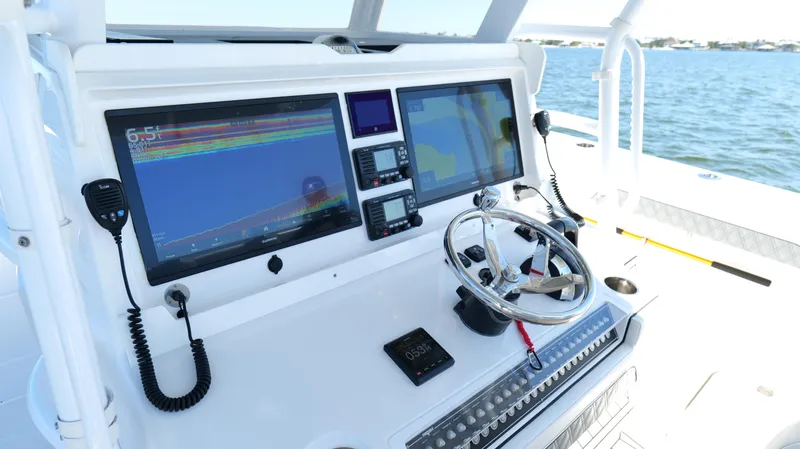 Engine Warranty X Trailer Yacht Photos Pics Cockpit of 2020 Invincible 37 Catamaran with advanced navigation displays and controls.