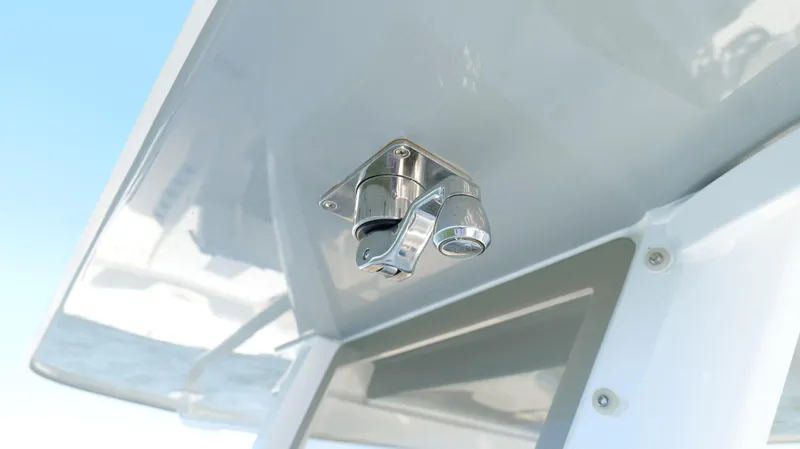 Engine Warranty X Trailer Yacht Photos Pics Close-up of a 2020 Invincible 37 Catamaran's stainless steel fixture under a canopy.