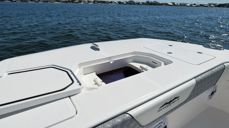 Engine Warranty X Trailer Yacht Photos Pics 2020 Invincible 37 Catamaran deck with storage compartment, on calm water.