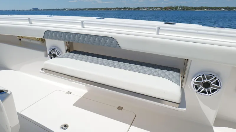 Engine Warranty X Trailer Yacht Photos Pics Invincible 37 Catamaran 2020 with cushioned seating and speakers, overlooking the ocean.