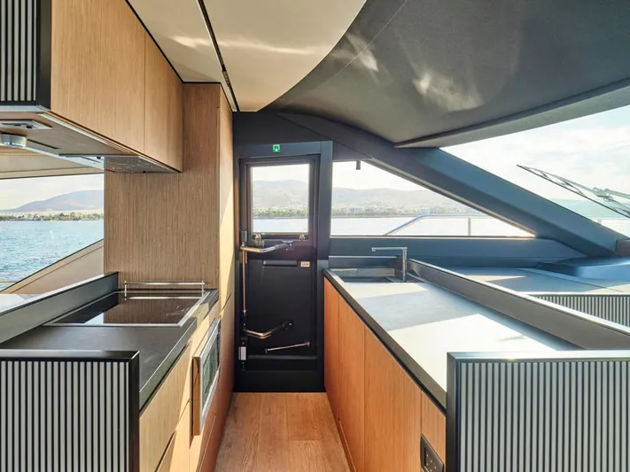 Never Give Up Yacht Photos Pics Modern kitchen interior of 2022 Ferretti Yachts 72 Flybridge Motor yacht.