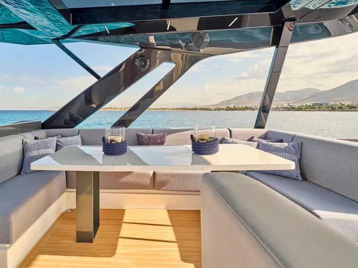 Never Give Up Yacht Photos Pics Luxurious seating area on 2022 Ferretti Yachts 72 Flybridge Motor yacht with ocean view.
