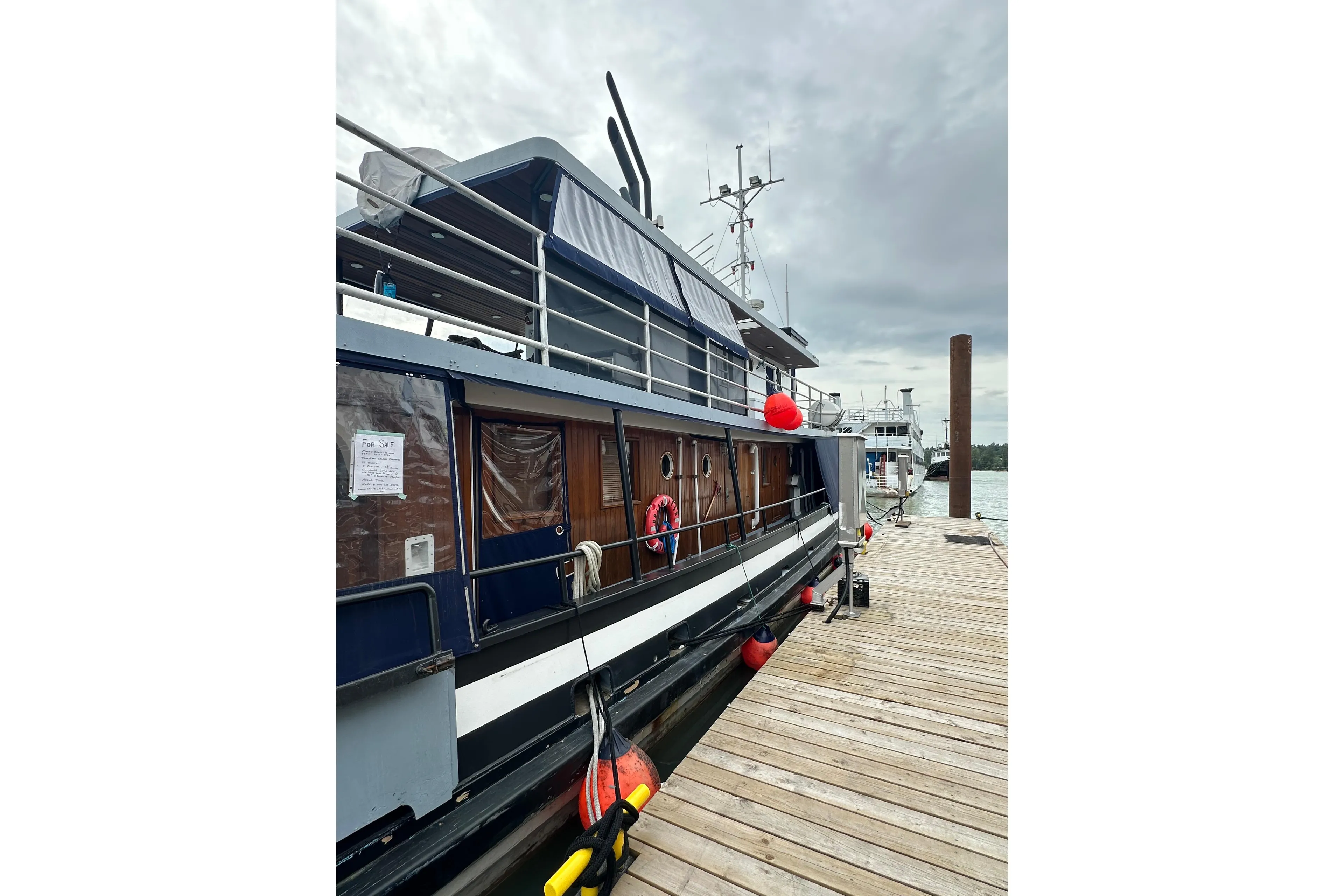 Historic 1941 McKenzie Barge & Derrick Co. Ltd tugboat docked, featuring classic design elements.