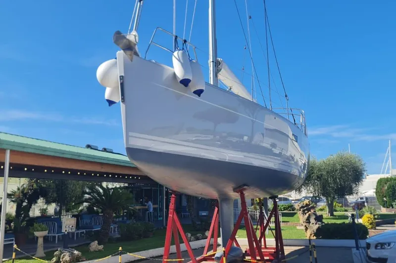  Yacht Photos Pics 2010 Hanse 400e sailboat on stands, displayed outdoors under clear blue sky.