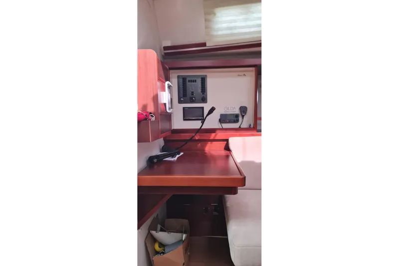  Yacht Photos Pics Interior of 2010 Hanse 400e yacht with navigation equipment and wooden finish.