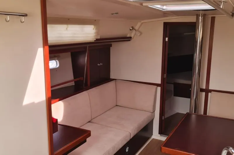  Yacht Photos Pics Interior of 2010 Hanse 400e yacht with beige seating and wooden accents.