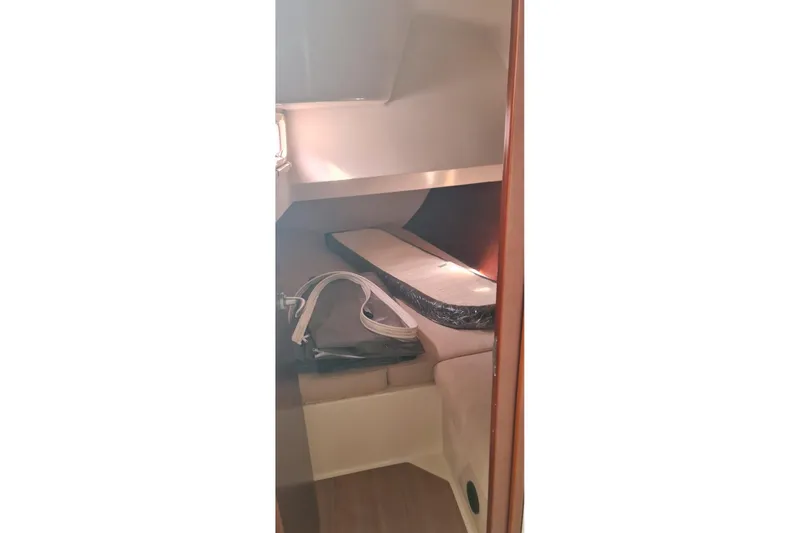  Yacht Photos Pics 2010 Hanse 400e yacht interior cabin with bed and storage space.