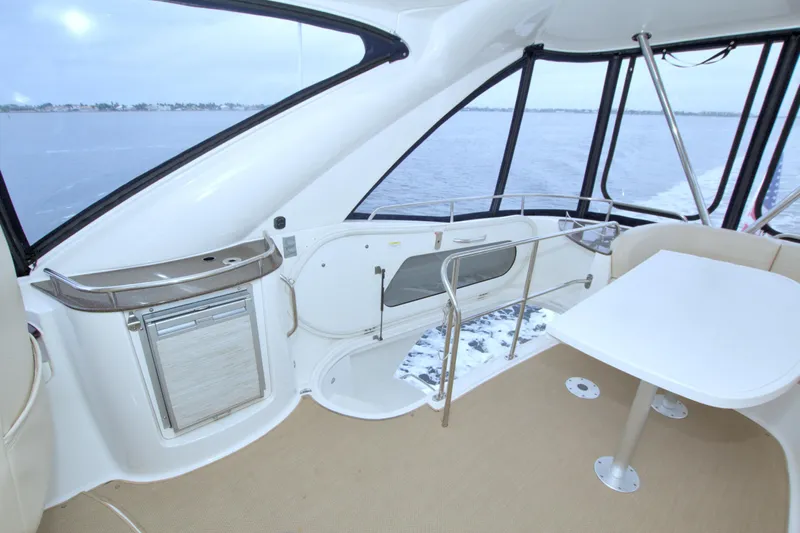 Why Knot Yacht Photos Pics 2013 Meridian 441 Sedan interior with table, seating, and ocean view.
