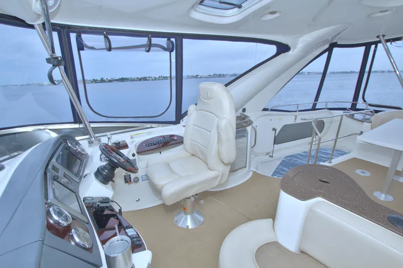 Why Knot Yacht Photos Pics Luxurious interior of a 2013 Meridian 441 Sedan yacht with panoramic windows.