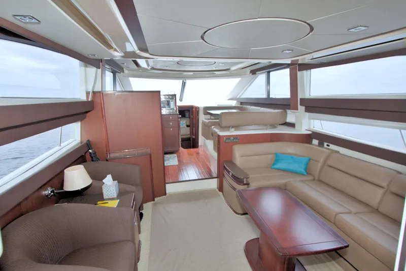 Why Knot Yacht Photos Pics Luxurious interior of 2013 Meridian 441 Sedan yacht with elegant seating and modern design.