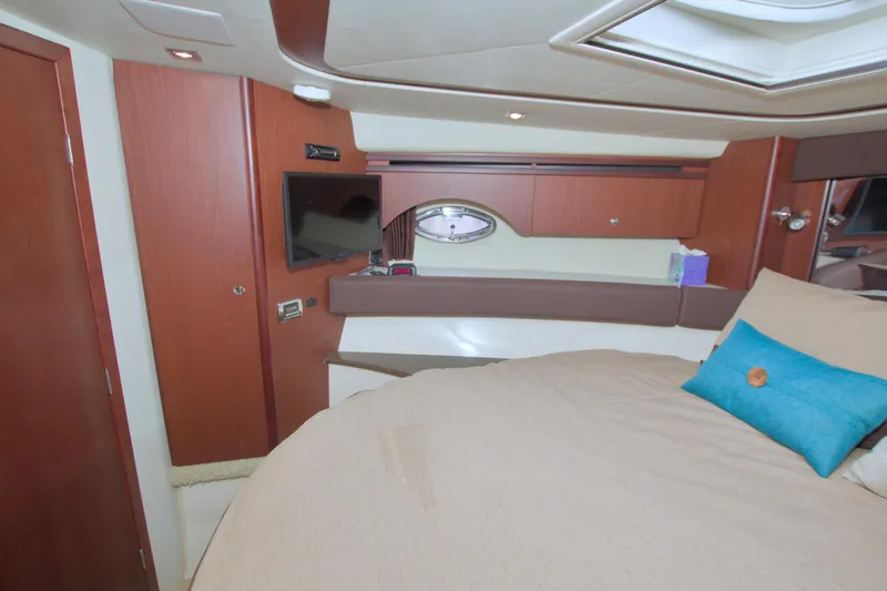 Why Knot Yacht Photos Pics Luxurious interior of 2013 Meridian 441 Sedan yacht with cozy bed and modern amenities.