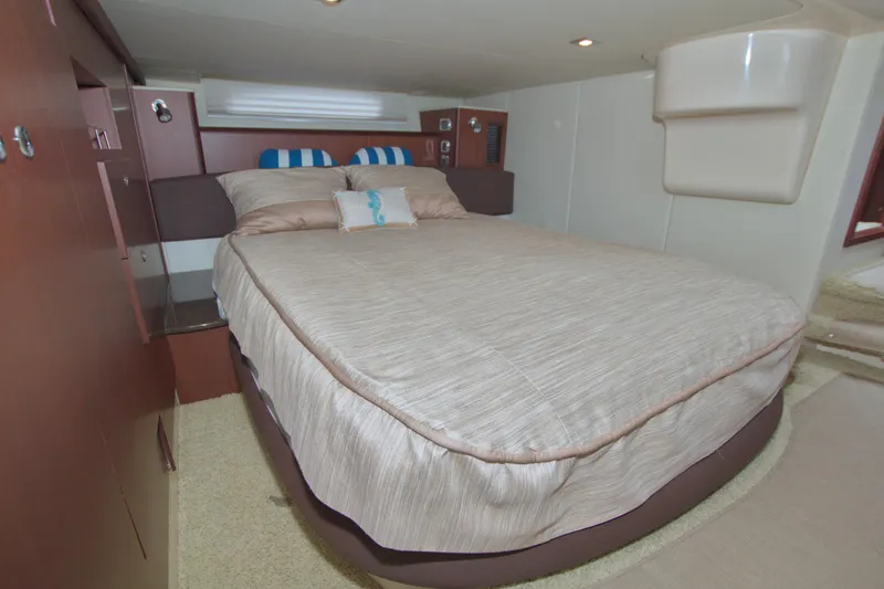Why Knot Yacht Photos Pics Luxurious bedroom interior of 2013 Meridian 441 Sedan yacht with cozy bedding.