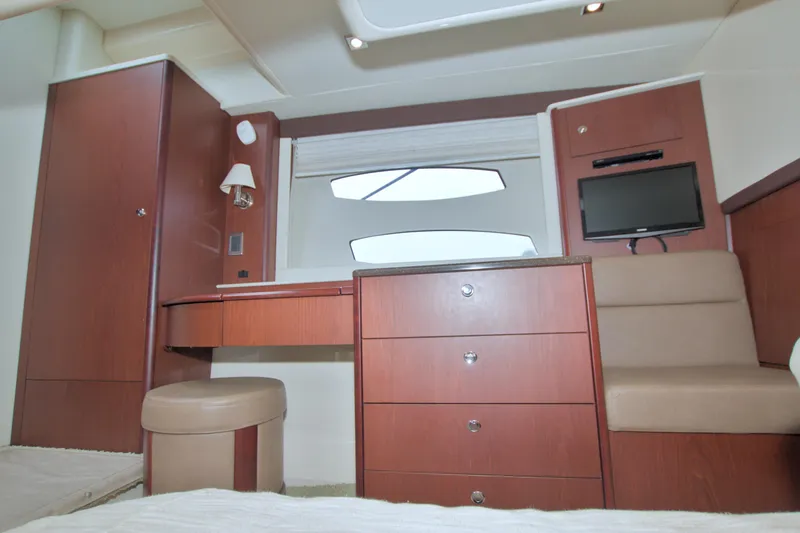 Why Knot Yacht Photos Pics Luxurious interior of 2013 Meridian 441 Sedan yacht with wood cabinetry and seating.