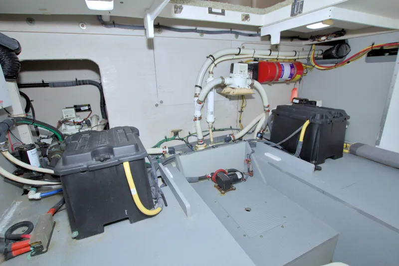 Why Knot Yacht Photos Pics Engine room of 2013 Meridian 441 Sedan with batteries and wiring.