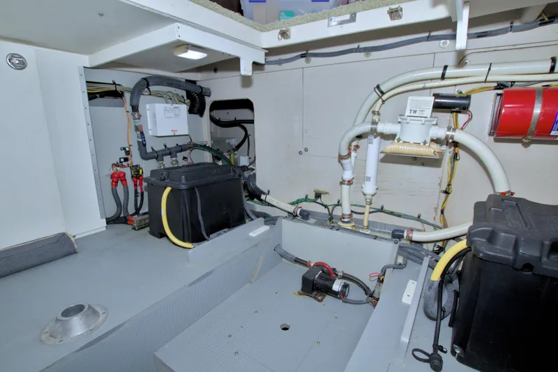 Why Knot Yacht Photos Pics Engine room of 2013 Meridian 441 Sedan with mechanical components and wiring.