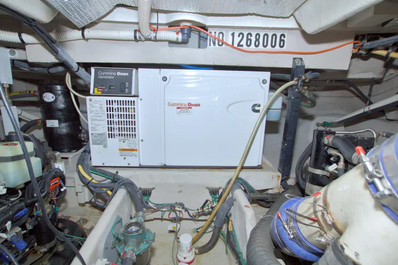 Why Knot Yacht Photos Pics Engine room of 2013 Meridian 441 Sedan with Cummins Onan generator and wiring.