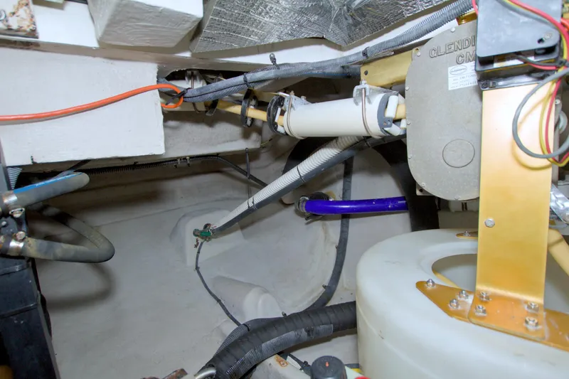 Why Knot Yacht Photos Pics Engine room of a 2013 Meridian 441 Sedan with visible wiring and components.