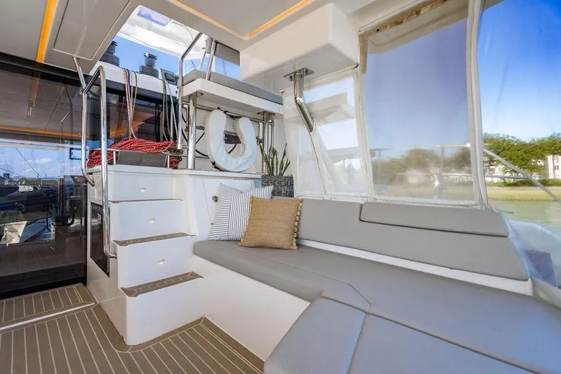 Scooby Yacht Photos Pics Luxurious interior of 2022 Leopard 50 yacht with seating and stairs.
