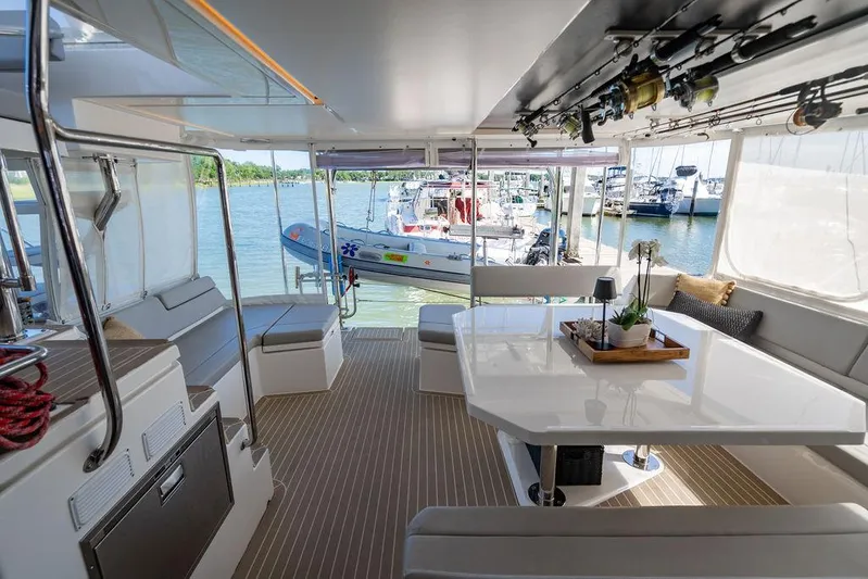 Scooby Yacht Photos Pics Luxurious interior of 2022 Leopard 50 yacht with elegant seating and dining area.