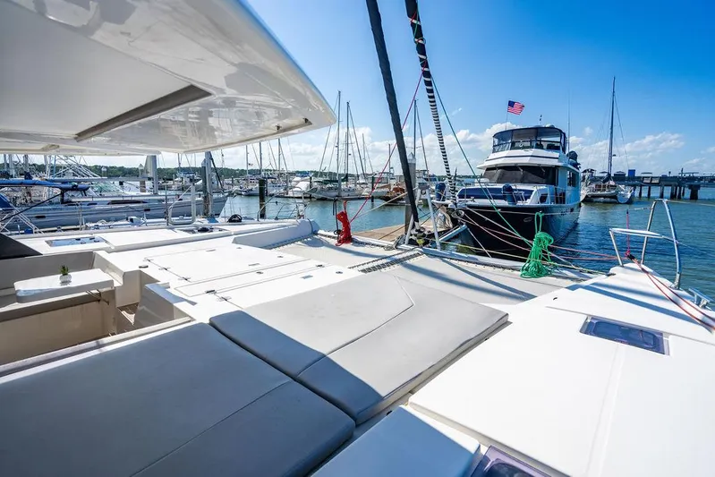 Scooby Yacht Photos Pics Luxurious Leopard 50 catamaran docked at marina, sunny day, 2022 model.