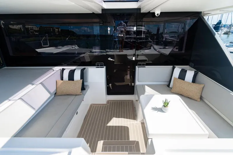 Scooby Yacht Photos Pics Luxurious Leopard 50 yacht interior with modern seating, cushions, and table, 2022 model.