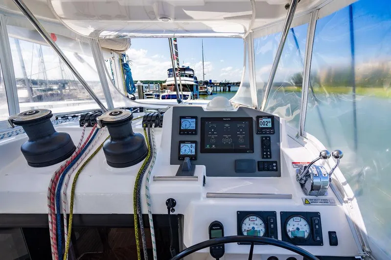 Scooby Yacht Photos Pics Cockpit view of 2022 Leopard 50 catamaran with navigation instruments and winches.