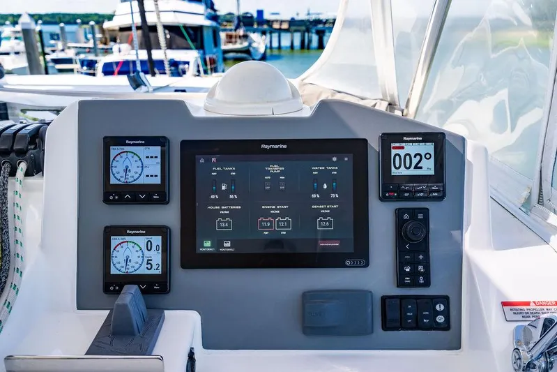 Scooby Yacht Photos Pics Leopard 50 yacht control panel with Raymarine displays, 2022 model, docked at marina.