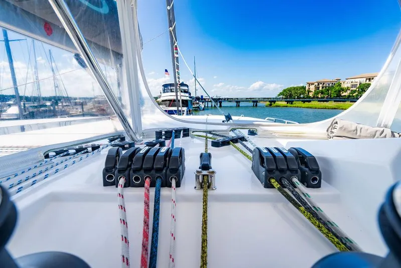 Scooby Yacht Photos Pics Sailing yacht deck view, Leopard 50, 2022 model, with ropes and marina backdrop.