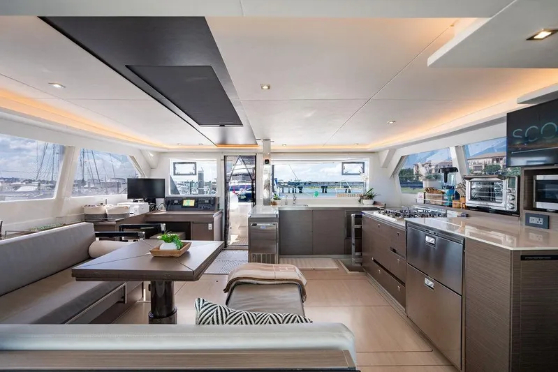 Scooby Yacht Photos Pics Luxurious interior of a 2022 Leopard 50 yacht with modern kitchen and seating area.