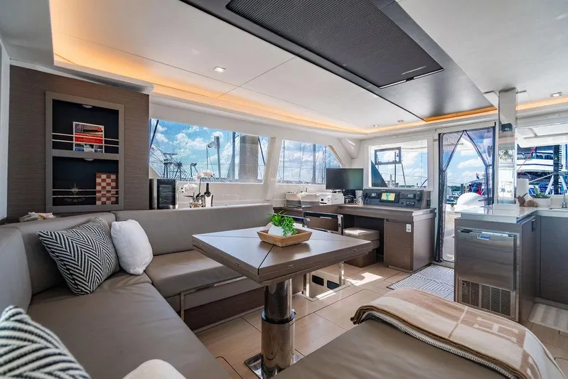 Scooby Yacht Photos Pics Luxurious interior of 2022 Leopard 50 yacht with modern furnishings and panoramic windows.