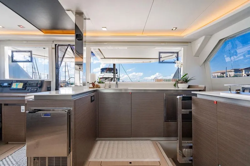 Scooby Yacht Photos Pics Luxurious interior of 2022 Leopard 50 yacht with modern kitchen and panoramic windows.