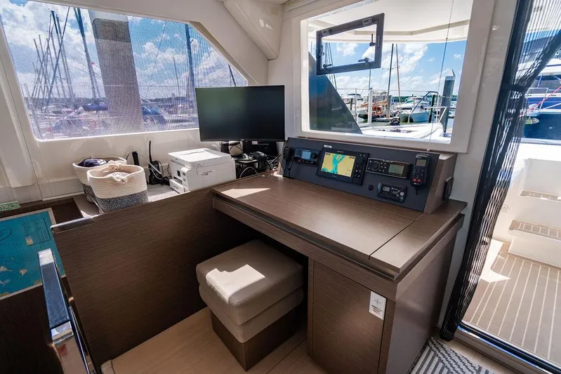 Scooby Yacht Photos Pics Interior of a 2022 Leopard 50 yacht with navigation station and marina view.