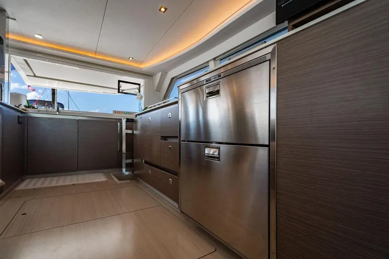 Scooby Yacht Photos Pics Modern kitchen interior on a 2022 Leopard 50 yacht, featuring stainless steel appliances.