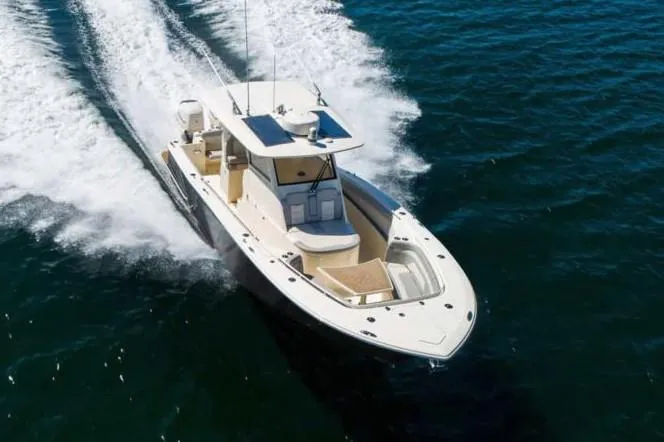  Yacht Photos Pics Manufacturer Provided Image: 2025 Scout 330 LXF boat cruising on open water, top view.
