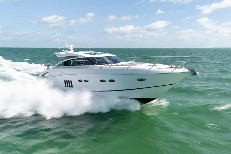 Luna Yacht Photos Pics 2009 Princess V62 yacht cruising on open sea under clear skies.