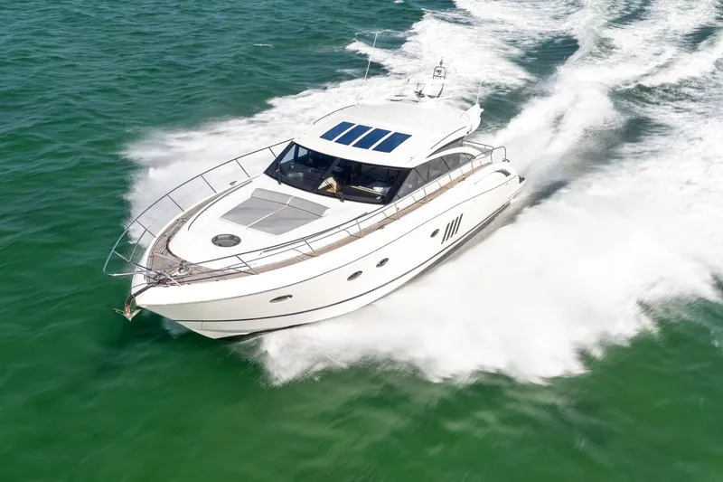 Luna Yacht Photos Pics Luxury 2009 Princess V62 yacht cruising on open water.