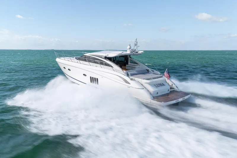 Luna Yacht Photos Pics Luxurious 2009 Princess V62 yacht cruising swiftly on open sea.