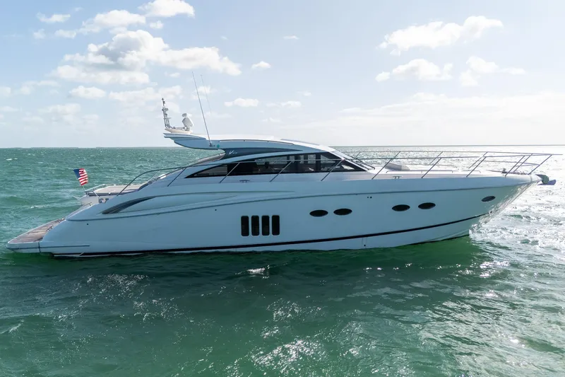 Luna Yacht Photos Pics 2009 Princess V62 yacht cruising on open water under a clear sky.