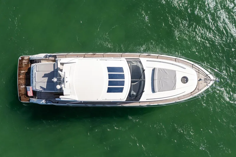 Luna Yacht Photos Pics Aerial view of 2009 Princess V62 yacht on green water.