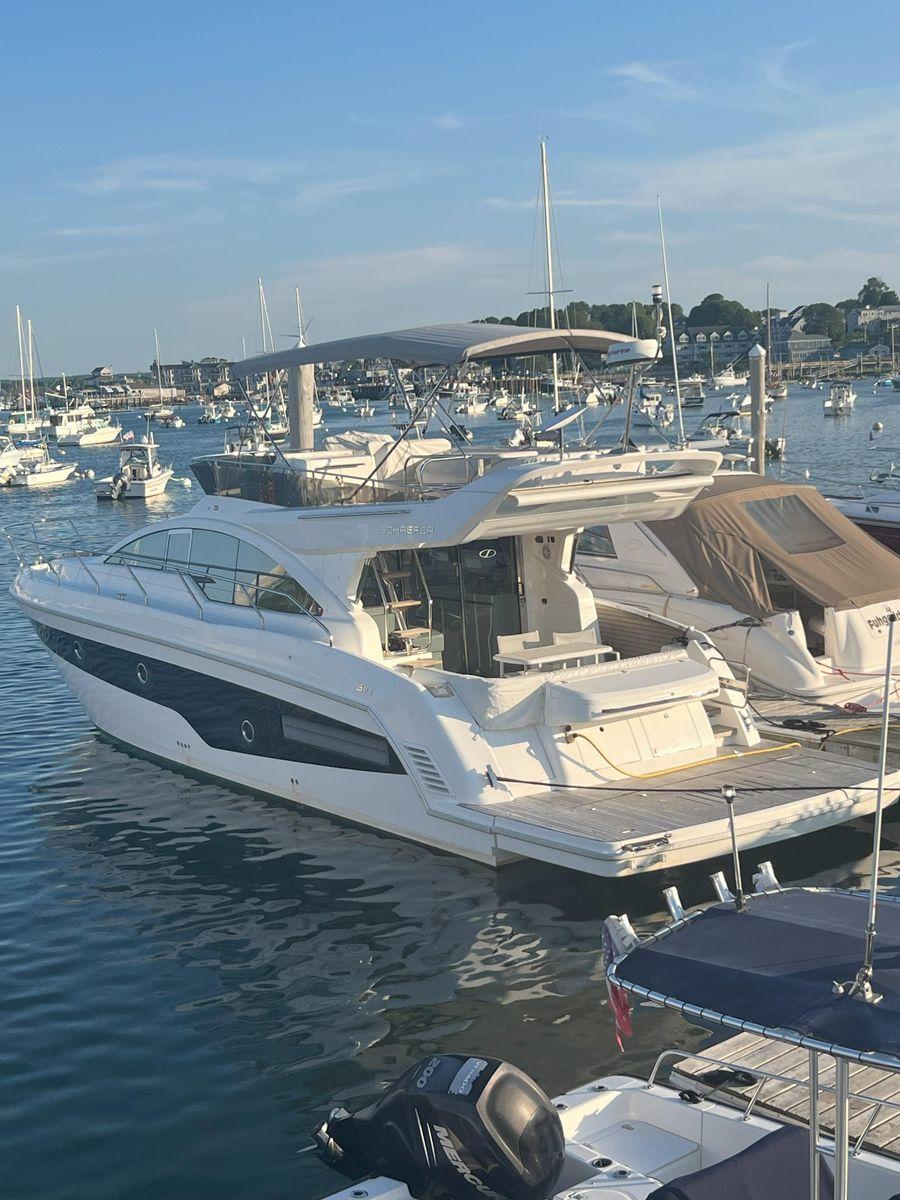 Luxury Schaefer 510 yacht docked in a marina, 2019 model.