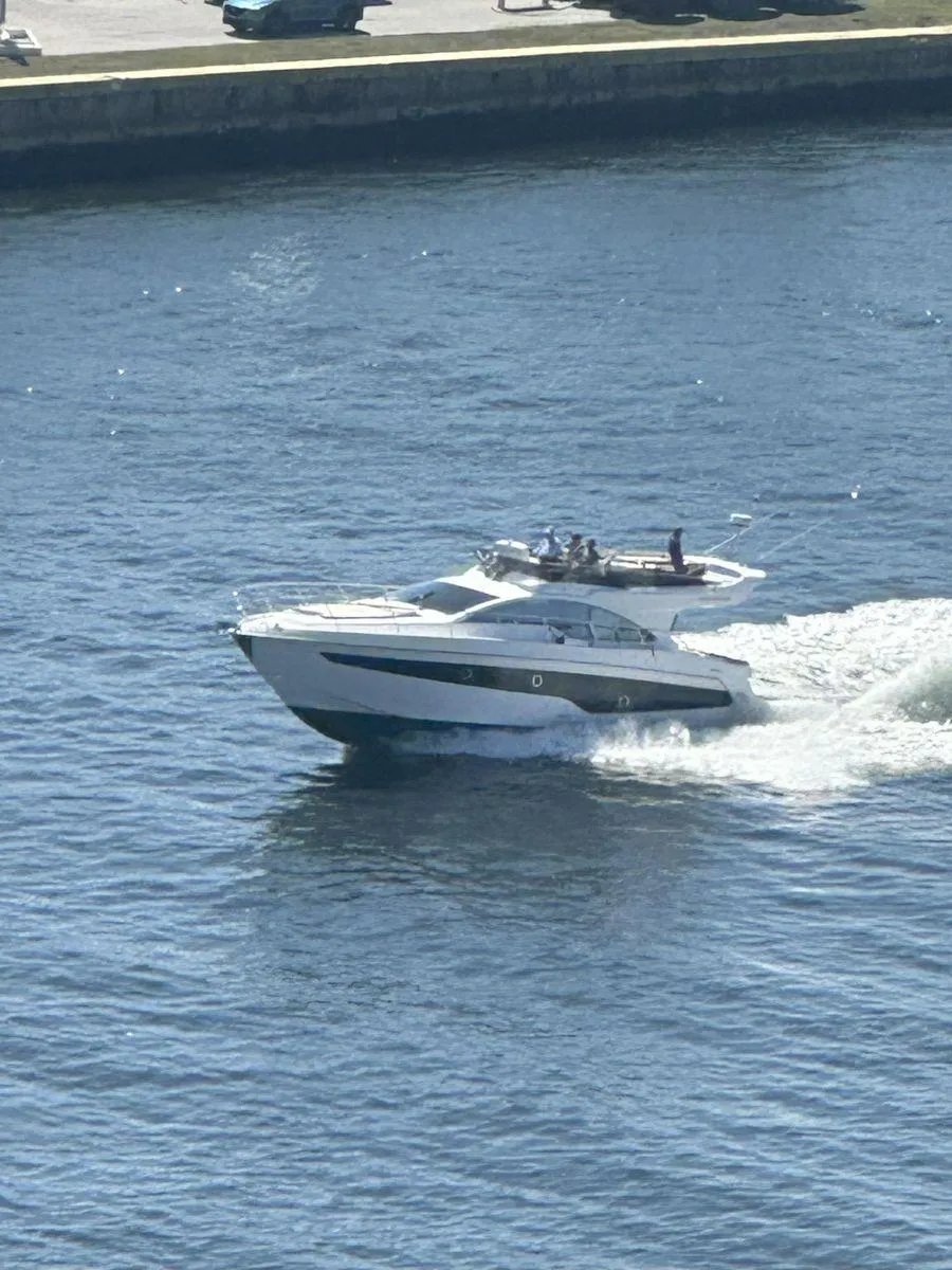 2019 Schaefer 510 yacht cruising on a sunny day in open water.